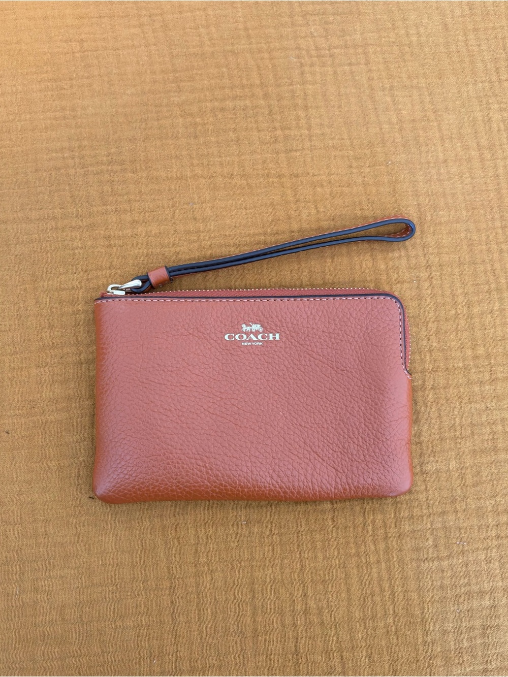Coach Pebbled Leather Corner Zip Wristlet Brown Cognac
